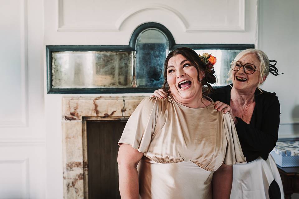Bridesmaid and her mum laugh