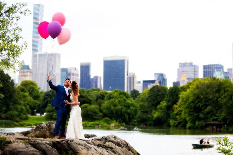 Standing with balloons