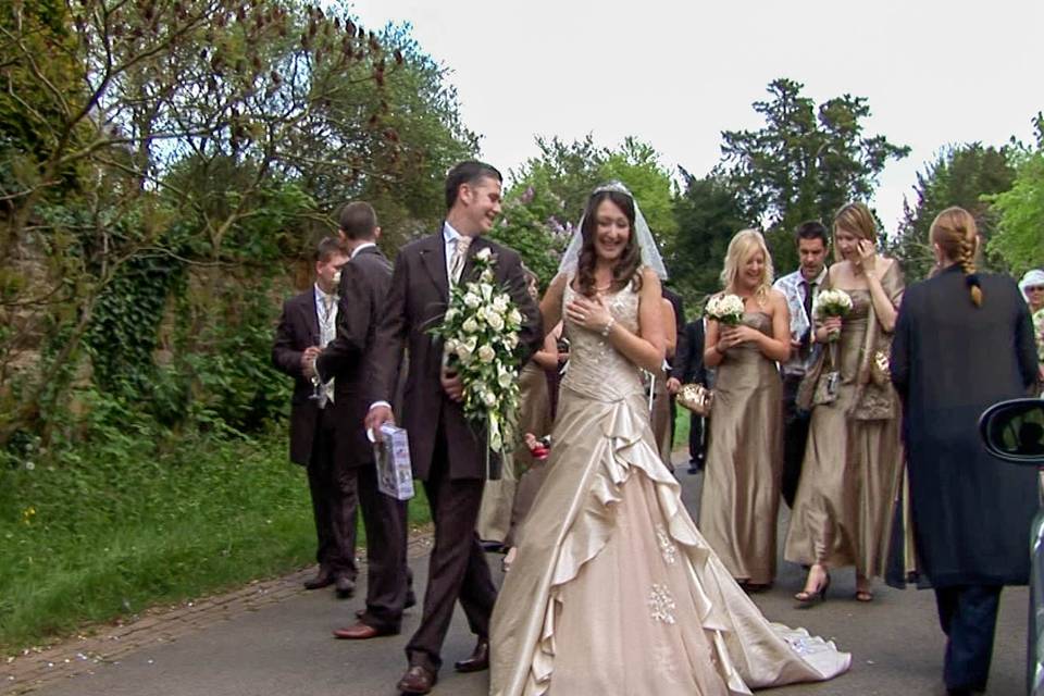 Wedding party and guests outside