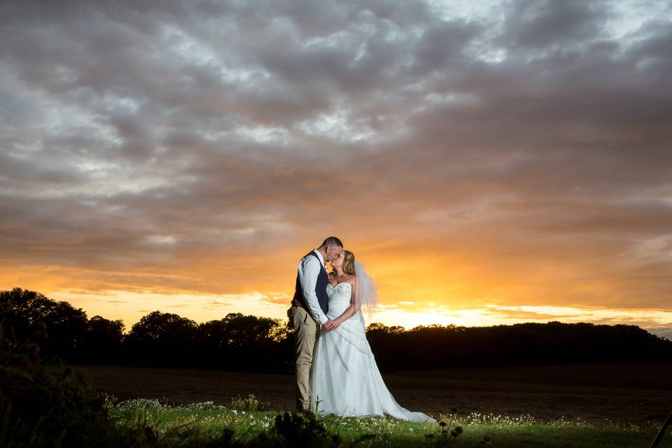 Bride and groom at sunset