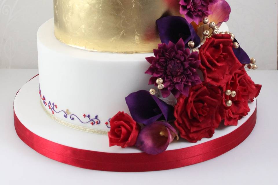 Gold and red wedding cake
