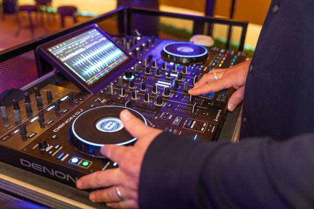 DJ hands on mixer