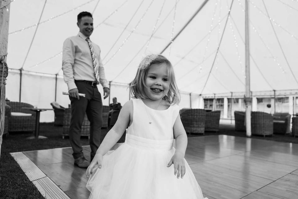 Little girl dancing at wedding