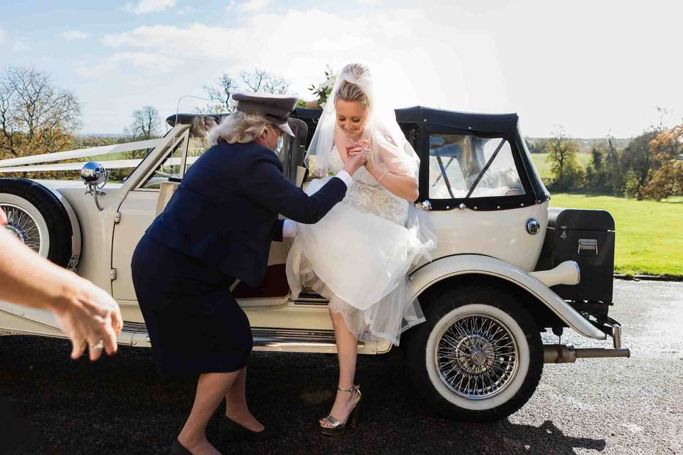 Bride getting out of car