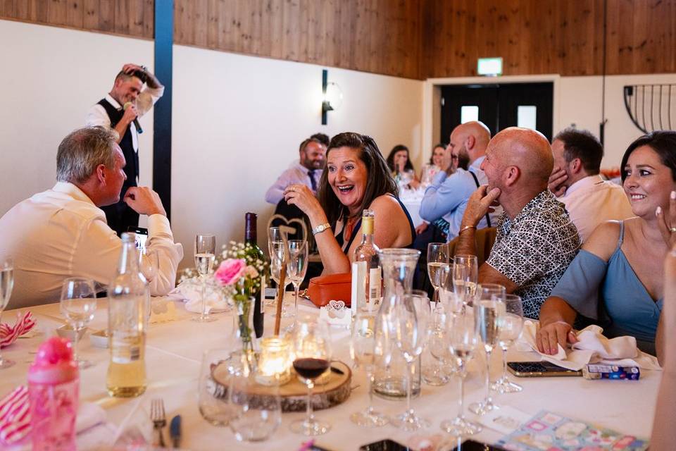 Guests laugh at speech