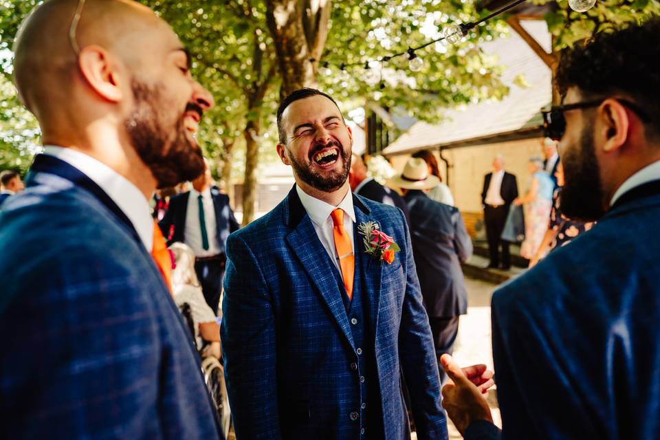 Groom laughing