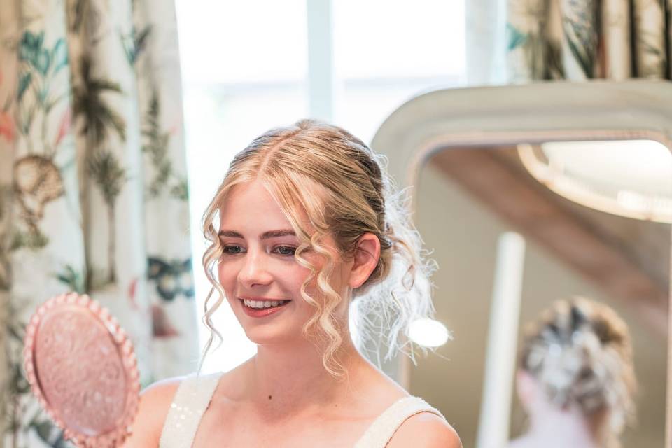 Bride looking in mirror