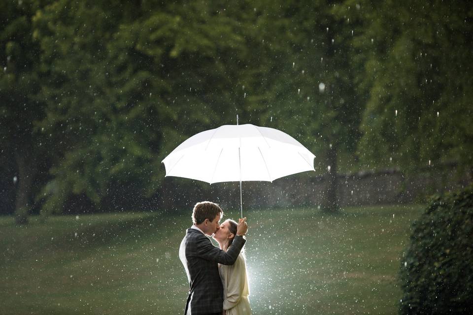 Kissing under the umbrella - Philip Bedford Wedding Photography