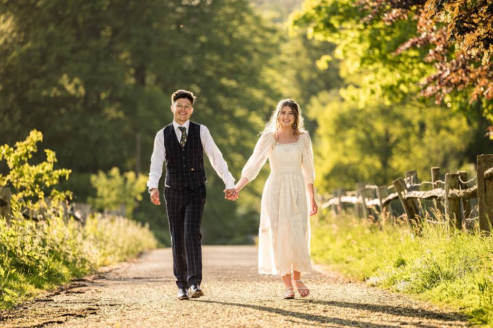 Bride and groom walking in gol