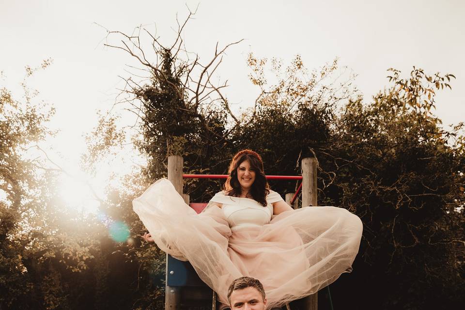 Bride and groom on a slide