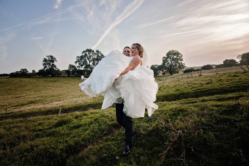 Carrying your happy bride