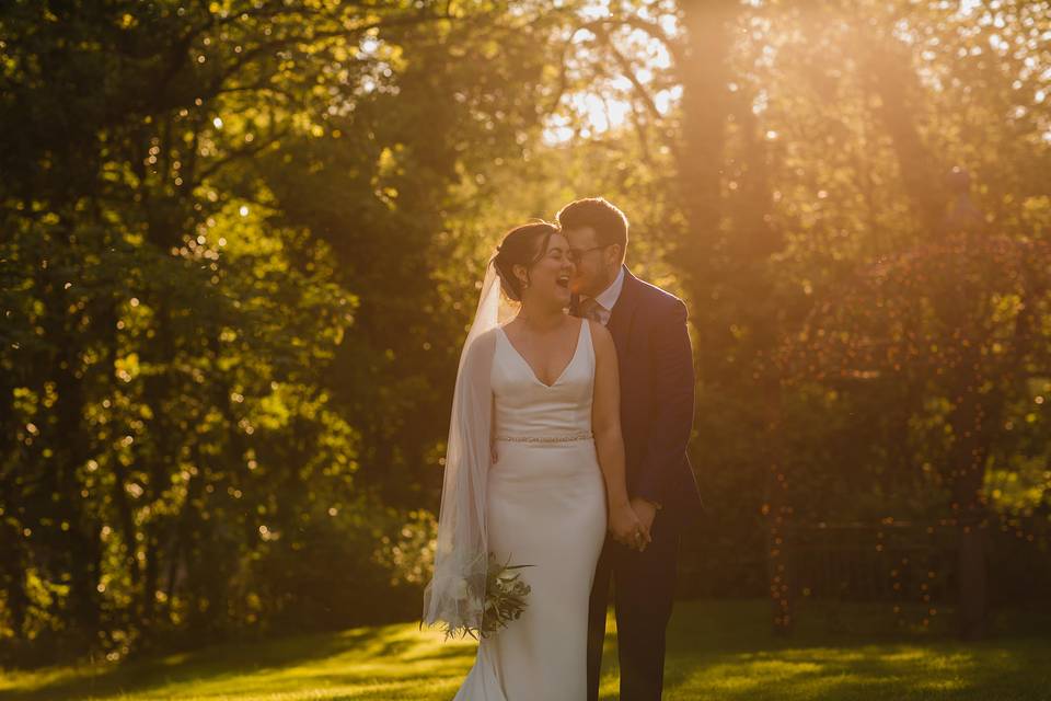 Newlyweds in golden sunlight