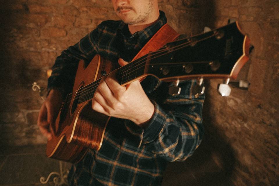 George on the acoustic guitar