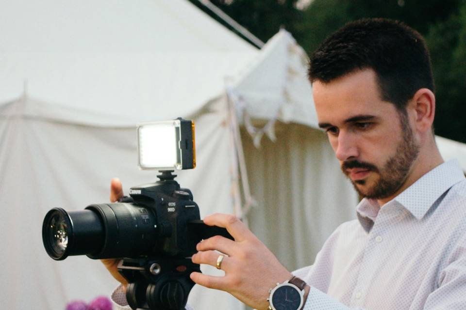 Josh filming at a wedding in D
