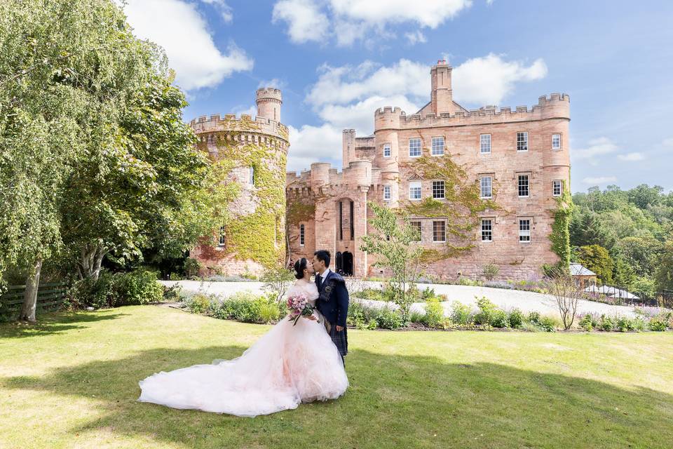 Couple on grounds in front of