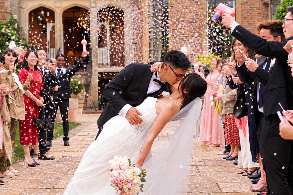Wedding confetti kiss.