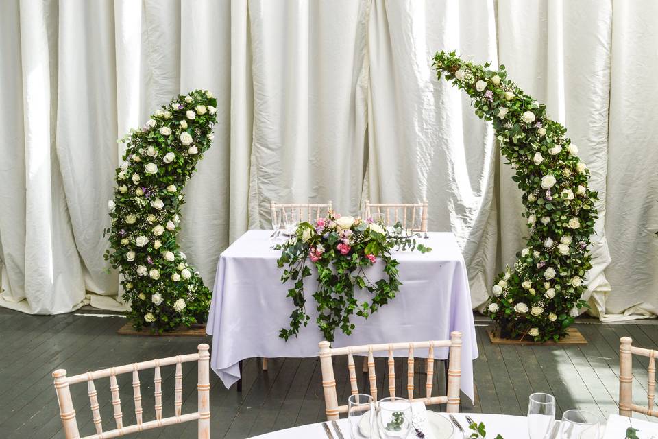 Bride and grooms table with ha