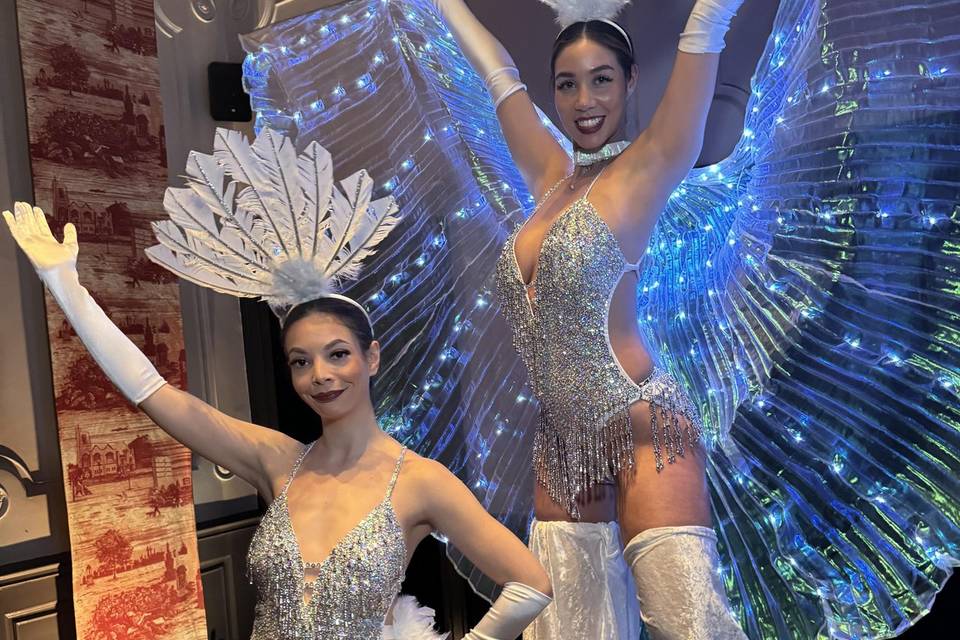 Show girls on stilts or foot