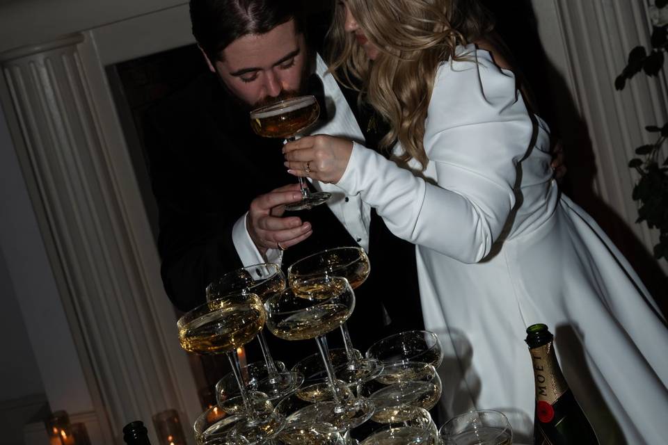 Groom sipping champagne