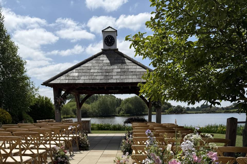 Outdoor ceremony meadow aisle