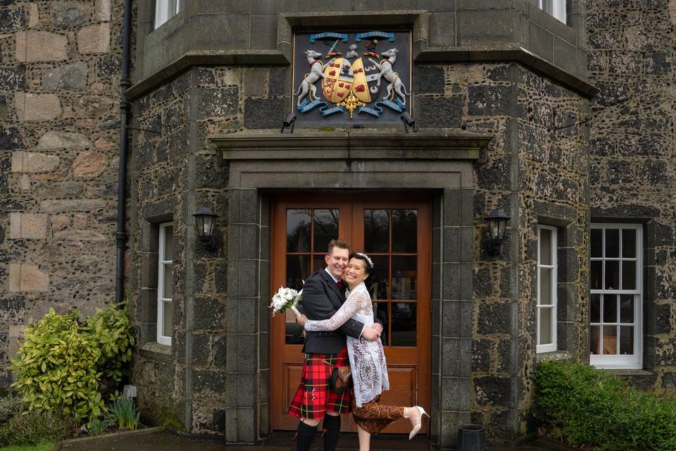 Couple outside wedding venue