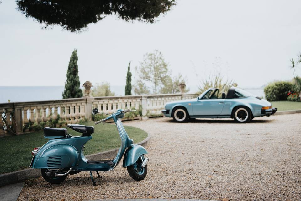 Moped and vintage car