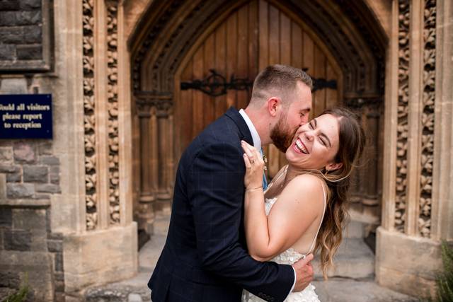 Smiling and a kiss on the cheek