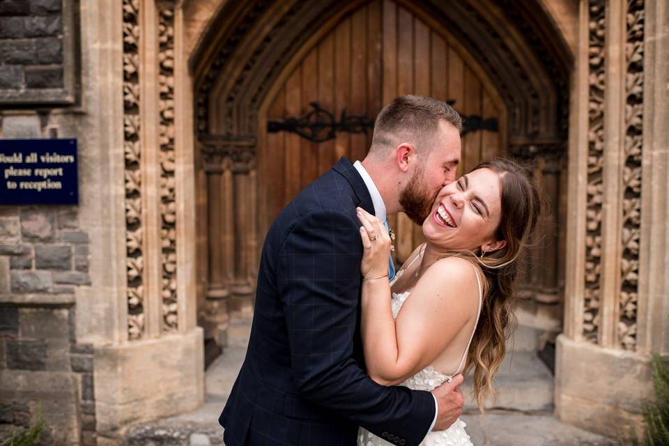 Smiling and a kiss on the cheek