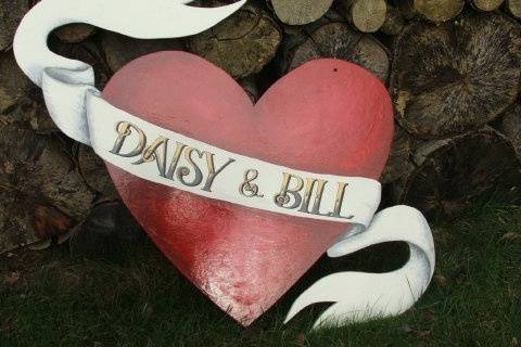 Heart shaped painted personalised sign with white ribbin to hang it