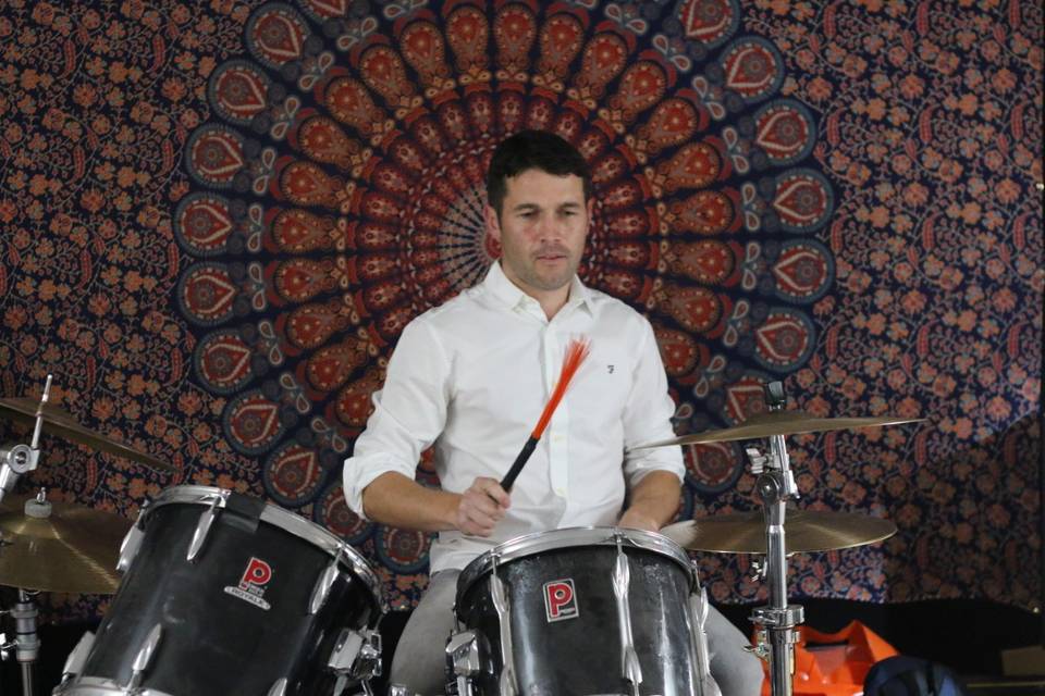 Tom on drums