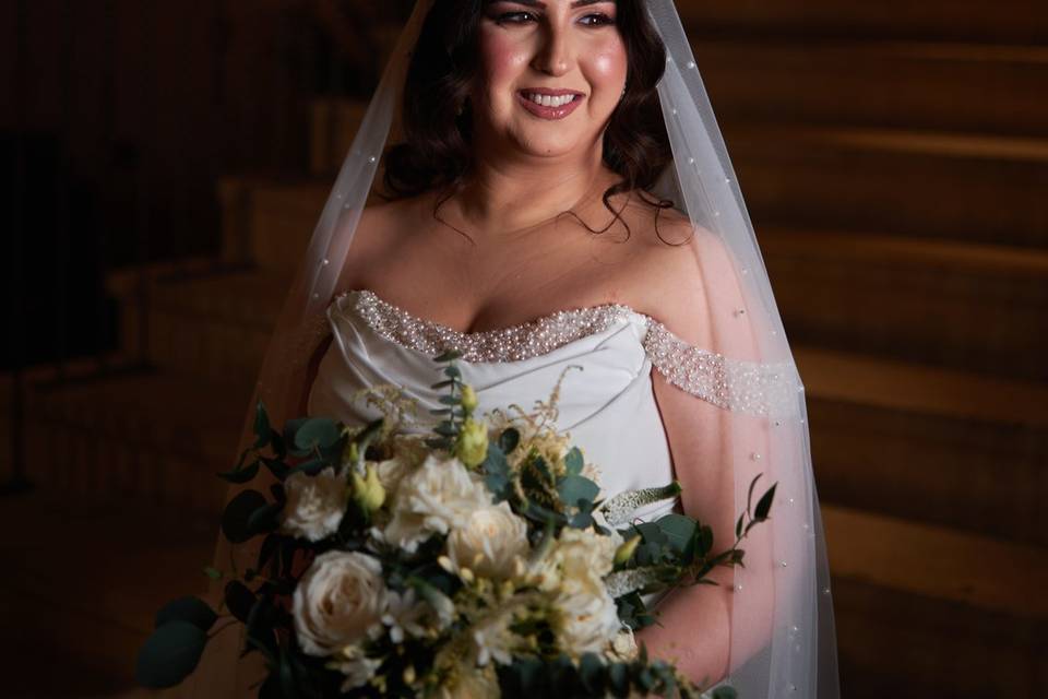 Bride in statement veil under