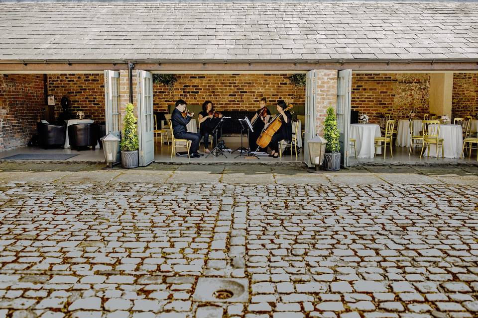 Meols Hall musicians courtyard