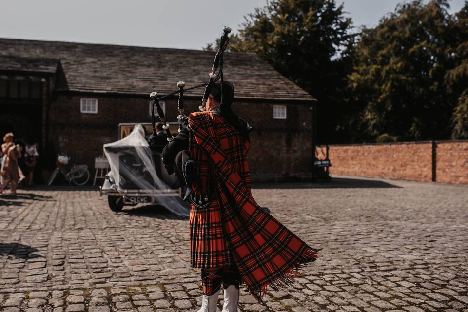 Meols Hall courtyard bagpipes