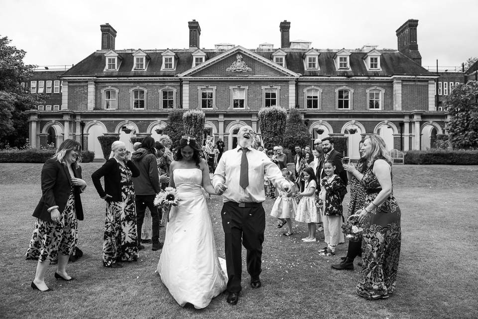 Couple walk thru confetti