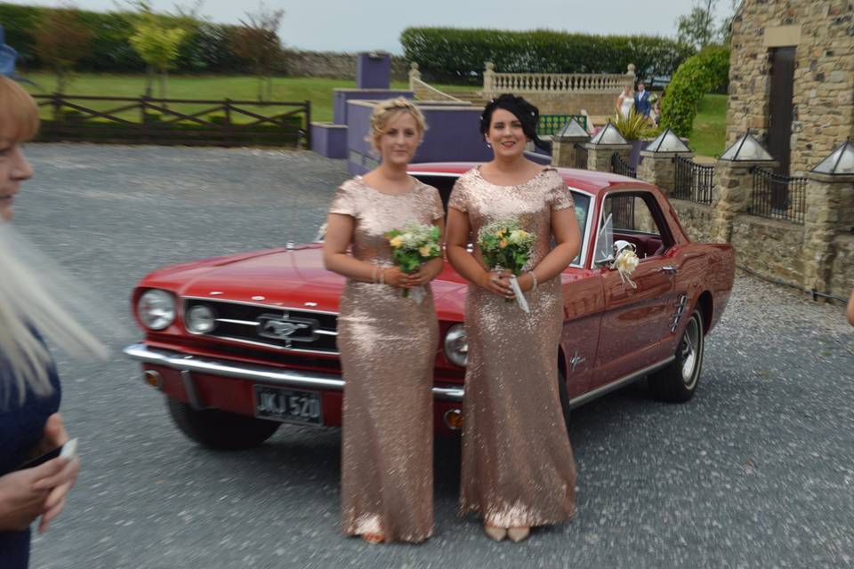 Bridesmaids with red mustang