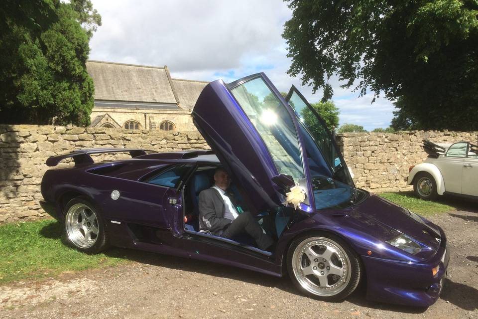 Happy couple in Ferrari