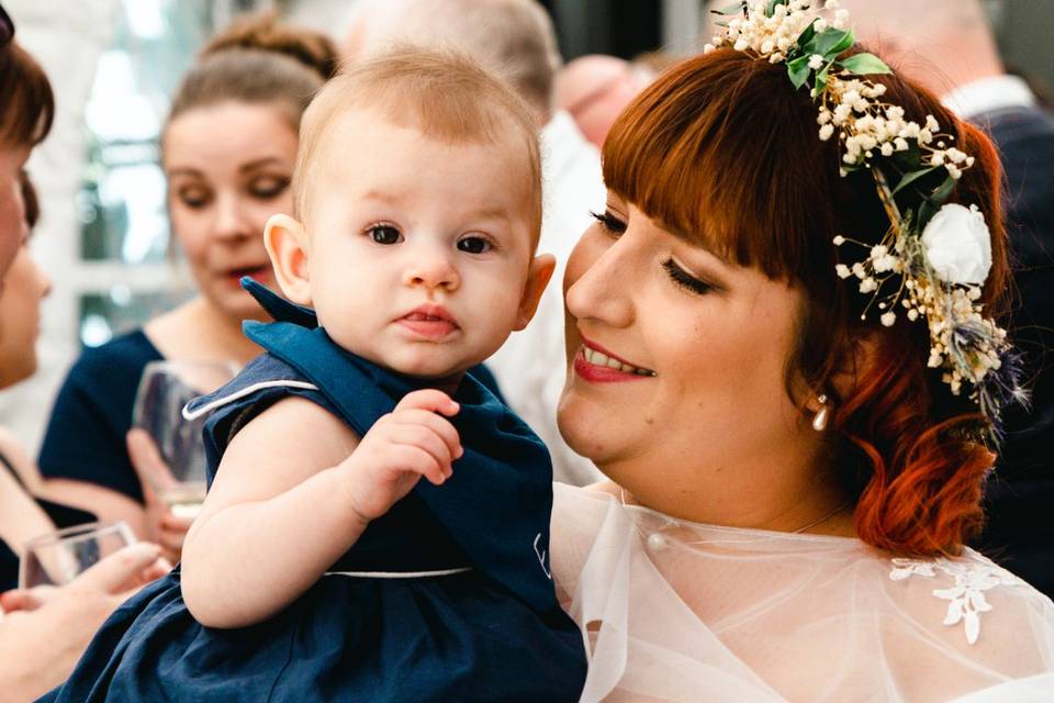 Bride holding a baby
