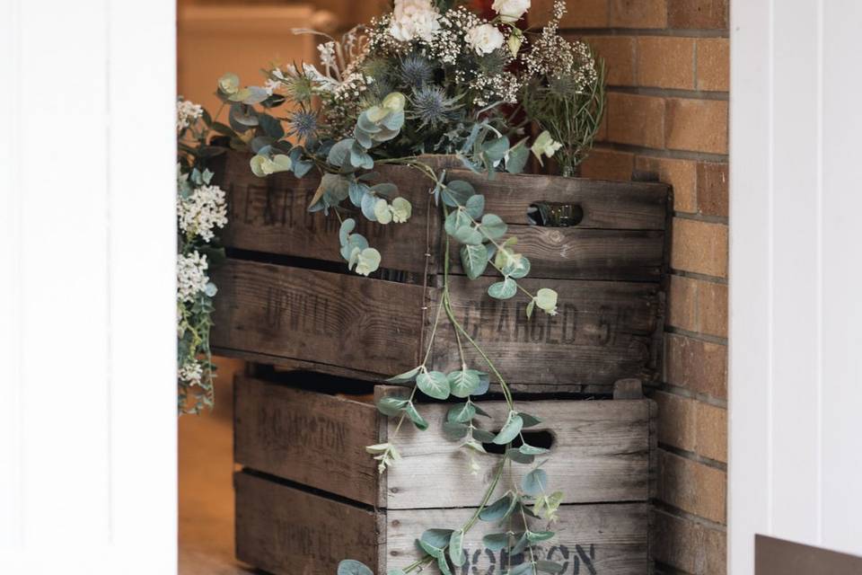 Rustic crates with greenery