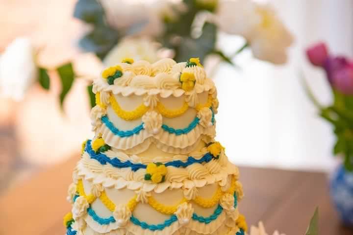 Three-tier yellow wedding cake