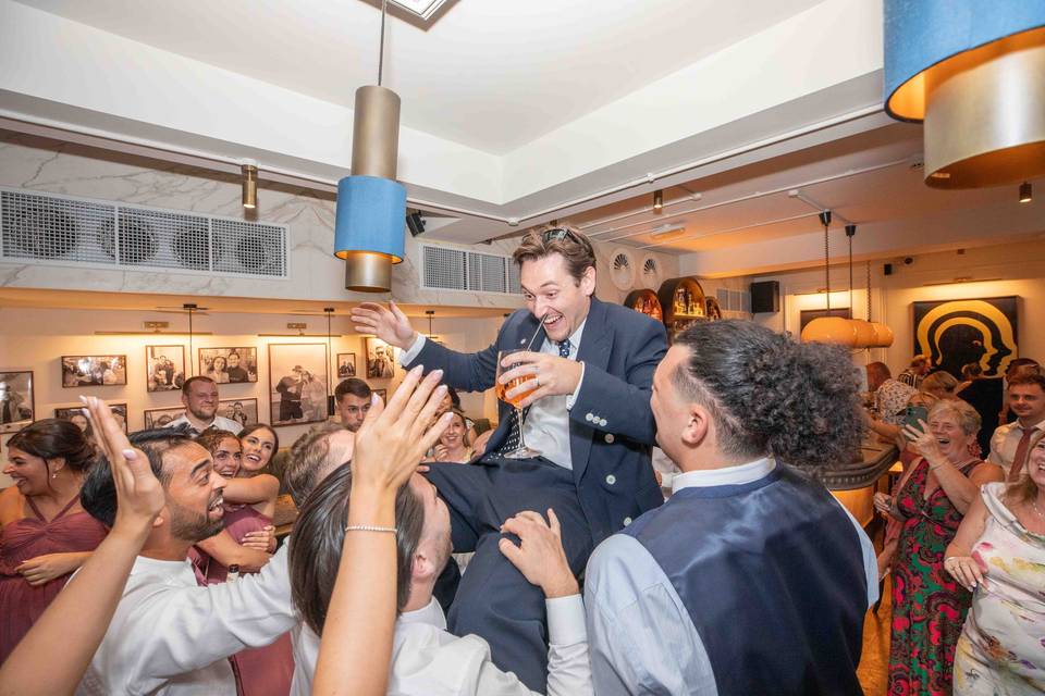 Lifting the groom up