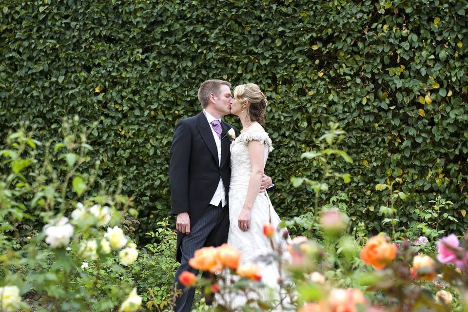 Bride and Groom in Rose Garden