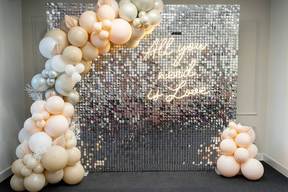 Sequin wall, balloons and neon