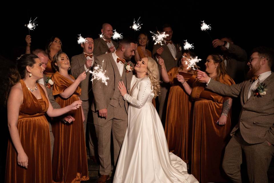 Sparklers and wedding party