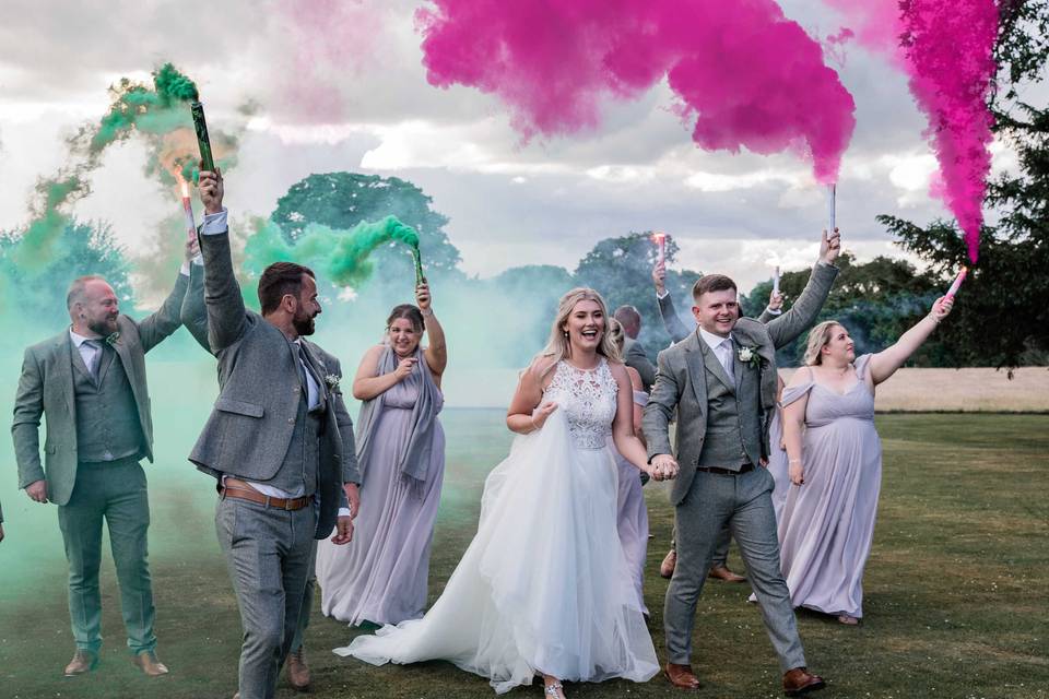 Colourful smoke and wedding party