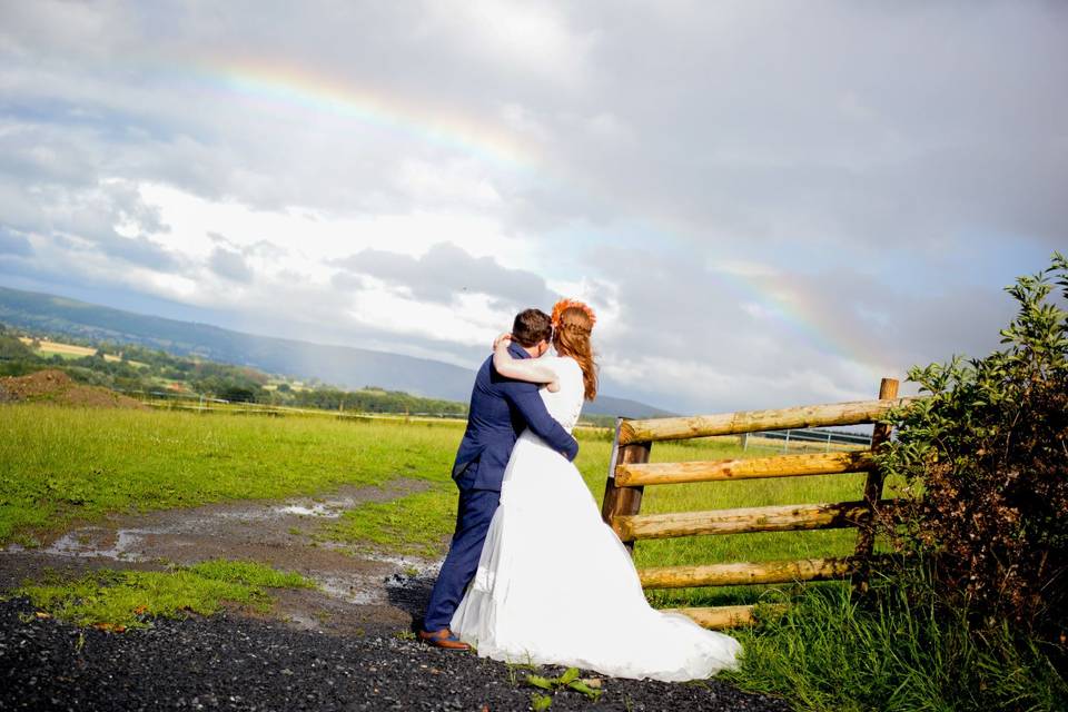 Holding each other and watching the rainbow