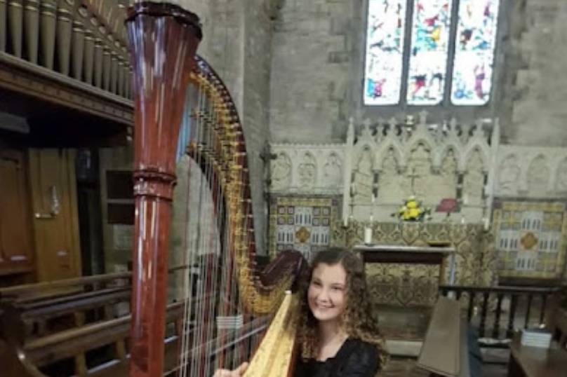 Harpist at Charity Concert for Church