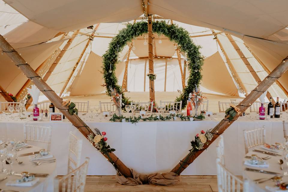 Boho tipi and wedding foliage