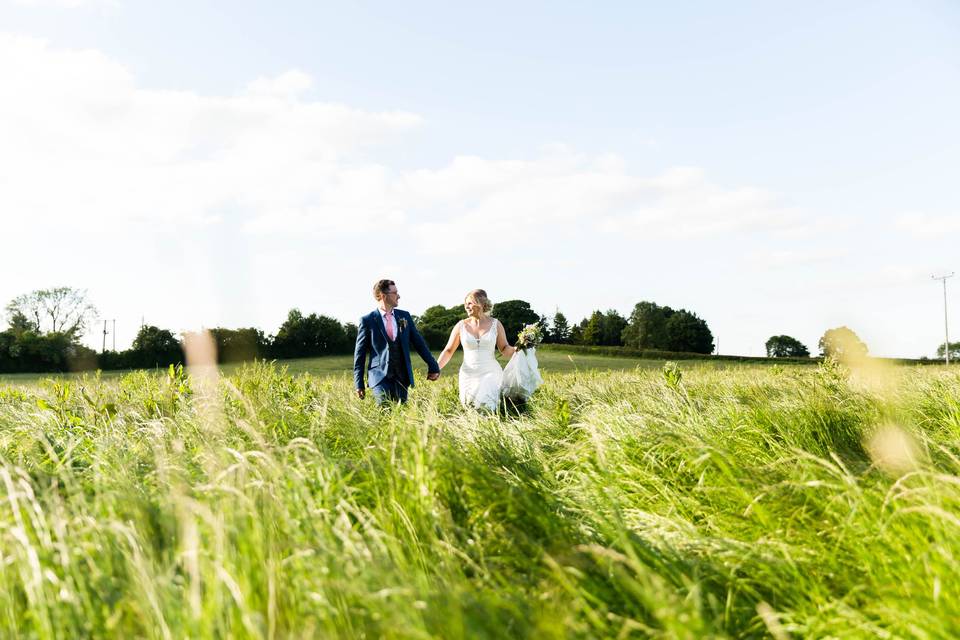 Bride and Groom in a field