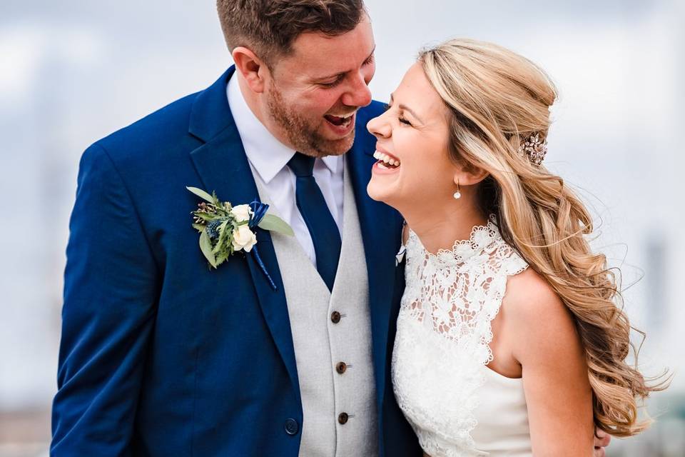 Happy bride and groom laughing