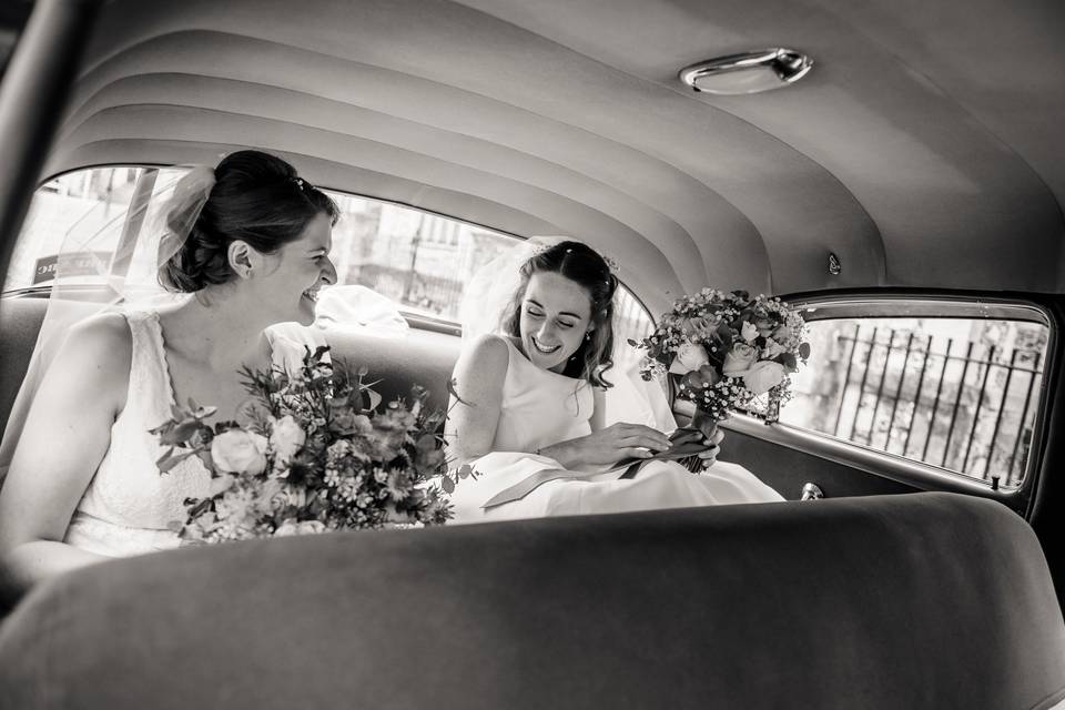 Bride and bride in wedding car